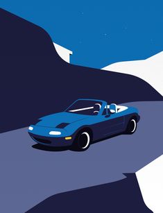 a blue sports car driving down a road next to a snow covered mountain under a blue sky