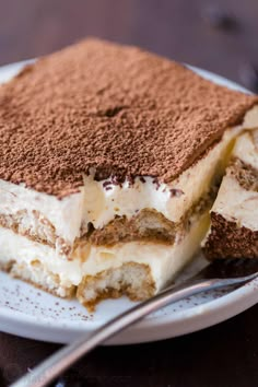 a piece of tirami cake on a plate with a fork