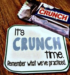 a sticker that says it's crunch time and is next to a candy bar