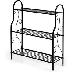 a black metal shelf with two shelves on each side and an iron frame around the bottom