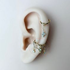 two ear piercings that are attached to each other