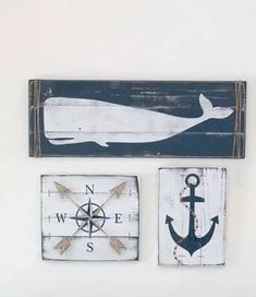 the wall is decorated with nautical signs and an anchor, whale, and ship wheel