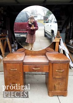 an old desk has been transformed into a dressing table with drawers and mirror on top