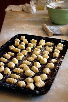 a pan filled with food sitting on top of a table