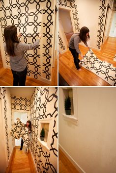 a woman standing in front of a wall with black and white designs on it