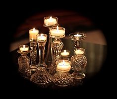 a group of candles sitting on top of a table