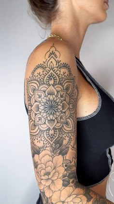 a woman with a tattoo on her arm