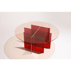 a glass table with red and white bases