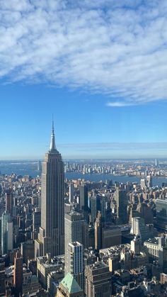 an aerial view of new york city with the empire building in the foreground