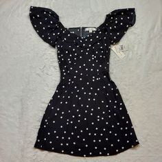 Rowa Black White Polka Dot Mini Dress Size Xs New With Tags! Ruffle Sleeves Have Elastic And Can Be Worn Off Shoulder. All Measurements Are Photographed, So Please Check The Photos To See Dimensions. Color Of Item May Appear Slightly Different In Photos Depending On Lighting And Phone Settings. Comes From A Smoke-Free, Pet Friendly Home. New To Poshmark? Use My Invitation Code Melodicrose For $10 Off Your First Purchase When You Sign Up! Bundle To Save $$$! Follow My Closet For New Listings! Hap Casual Polka Dot Mini Dress With Short Sleeves, Cute Fitted Black Mini Dress, Polka Dot Mini Dress, Strappy Mini Dress, Embroidered Lace Dress, Flutter Dress, Mod Cloth Dresses, Midi Wrap Dress, Pleated Mini Dress