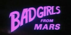 the neon sign for bad girls from mars is lit up in pink and purple colors