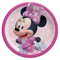 a minnie mouse paper plate with polka dots on the rim and a pink bow around it's neck