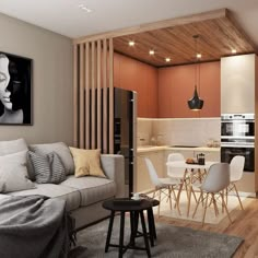 a living room filled with furniture next to a kitchen