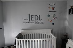 a baby's room with a white crib and wall decal that says, i am a jedi, like my father before me