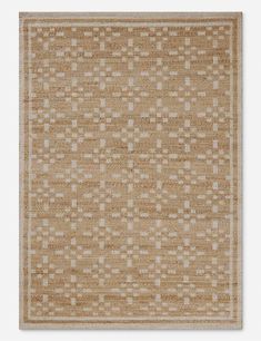 a beige rug with white squares on it