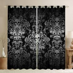 a black and white curtain with skulls on it