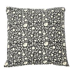 a black and white pillow on a white background