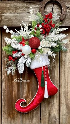 a christmas stocking hanging on the side of a wooden door