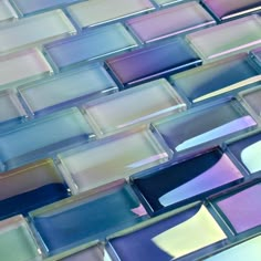 an image of colorful glass tiles that look like they have been made in different colors