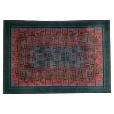 a red and blue rug with squares on it