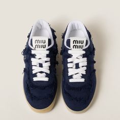 Find MIU MIU Denim Sneakers on Editorialist. Upper with fraying Fabric lining Screen-printed logo on the tongue and insole Cotton laces Rubber sole with logo Removable fabric-covered insole Designer Clothes Aesthetic, Shoes With Charms, Miu Miu Sneakers, Sneakers Aesthetic, Sneakers 2024, Designer Shoes Sneakers