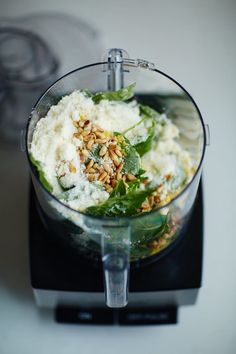 a blender filled with food on top of a counter