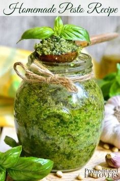 homemade pesto recipe in a jar with basil and garlic