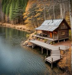 a cabin sits on the edge of a lake