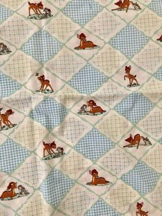 the fabric has horses and dogs on it