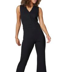 Very Flattering Jumpsuit/Pantsuit, Perfect For Work Or Travel, Looks Instantly Put Together And Professional Without Giving Up Comfort. Fabric Is Very Comfortable With A Thick Stretch Fabric And Garment Is Well-Made With Thoughtful Construction. One Of Spanx' Most Popular Items Because It Is Feminine And Very Female Figure Flattering. Please Note: Size Is Tall! I Am 5'9" And The Tall Is Perfect For Me In Length And Allows For A 1-2.5" Heel. I Should Have Bought An Extra Small (I Am A Size 4 Us) V-neck Elastane Jumpsuit For Work, Elastane Pantsuit For Workwear, Tailored Elastane Pantsuit, Black Elastane Jumpsuits And Rompers For Work, Black Elastane Jumpsuits For Workwear, Black Elastane Jumpsuit For Work, Fitted Jumpsuits And Rompers For Work, Fitted Overalls For Workwear, Fitted Elastane Jumpsuits And Rompers For Work