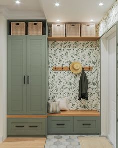 a room with some green cabinets and drawers