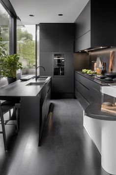 Modern kitchen with sleek black cabinetry, a kitchen island with stools, and large windows providing natural light. Maximize Kitchen Storage, Hispanic Kitchen