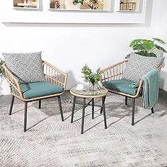 two chairs sitting next to each other on top of a rug