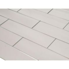 a close up view of a white tile floor