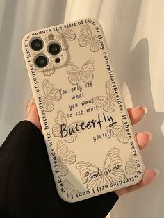 a person holding a cell phone case with butterflies on it and the words, you only see what you want to see more