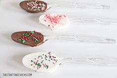 four spoons with chocolate and sprinkles on them