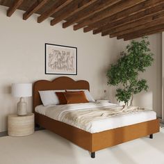 a large bed sitting under a wooden beam in a bedroom next to a potted plant