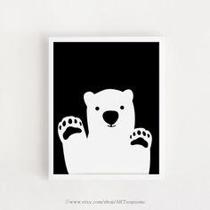 a polar bear with its paws up in the air on a black and white background