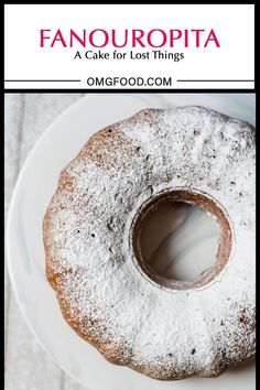 a close up of a doughnut on a plate with the words fanouropita above it