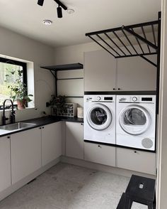 a washer and dryer in a small room