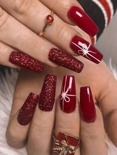 red stiled nails with bows on them