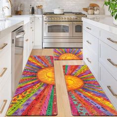 colorful kitchen rugs on the floor in front of an oven