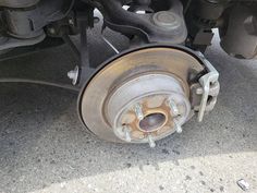 the front wheel and brake assembly of a car with brakes on it's side