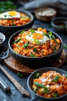 several bowls filled with rice and vegetables on top of a table