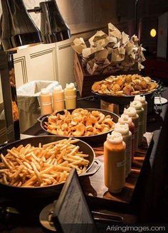 there are many different types of food on the table together, including french fries and macaroni and cheese