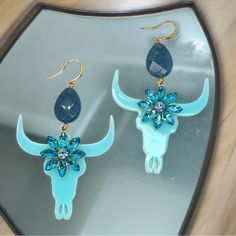 Add A Pop Of Color And Western Flair To Your Accessory Collection With These Striking Longhorn Dangle Earrings! These Stunning Earrings Feature A Unique Blend Of Materials Including Zinc Alloy, Acrylic, Glass Beads, And Rhinestones, Offering A Vibrant, Eye-Catching Look. Perfect For Dressing Up Any Outfit, These Earrings Will Make You Stand Out In Any Crowd. Whether You're Going For A Casual Look Or Something More Sophisticated, These Earrings Are A Versatile Addition To Your Jewelry Collection. Blue Teal, Stunning Earrings, Style Jewelry, Western Style, Unique Earrings, Zinc Alloy, Casual Looks, Glass Beads, Color Pop