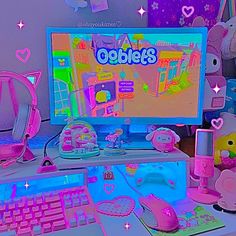 a desk with a computer, mouse and other items on it in front of a purple background