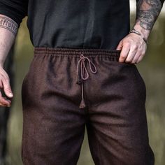 Brown Viking Trousers / Pants - Wool | Medieval Pants Straight cut with an elastic waist band, pockets and a drawstring (which can be easily hidden with a tunic). Can be worn with or without leg wraps. Material: 74% wool, 16% polyester 5% nylon, 3% cotton, 2% viscose.Color: Brown. Sizes: S, M, L, XL, 2XL and 3XL (each are adjustable). Care: We recommend washing with cold water using the delicate/fine wash cycle. Worldwide shipping available!Custom made to order: Please allow up to 1-3 weeks befo Viking Trousers, Medieval Pants, Medieval Shirt, Medieval Tunic, Horns Decor, Leg Wraps, Beard Beads, Bead Hair Accessories, Viking Clothing