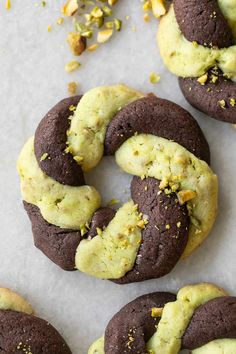 several cookies with chocolate and yellow sprinkles