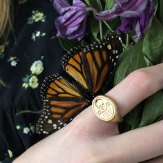 Inspired by a Renaissance Memento Mori ring circa 1600, our Memento Mori Signet Ring is an embossed skull with two enter twined posies and two M initials for Memento Mori. We love how this looks so modern and yet it's fit for a Queen and her court. Brass plated in a matte goldtone. Keep dry for best care. All orders over $50 ship for free within the USA. All orders usually ship within 24 hours from the USA. Memento Mori Ring, Skull With Flowers, Gold Signet Ring, Memento Mori, Signet Ring, Alex And Ani Charm Bracelet, Gold Rings, Initials, Best Gifts